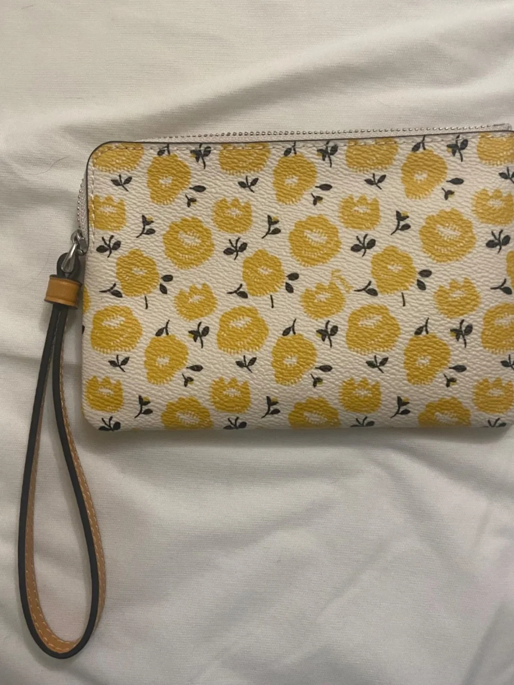 Coach wristlet with floral print